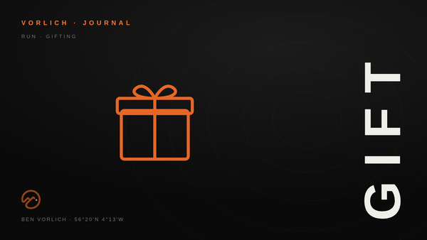 GIFT — Vorlich Journal cover: orange outline gift box pictogram on black with contour rings